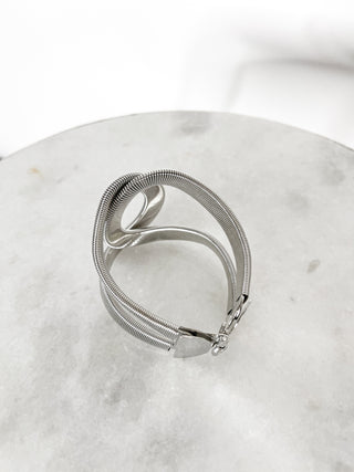 Bracciale rigido con intreccio doppio